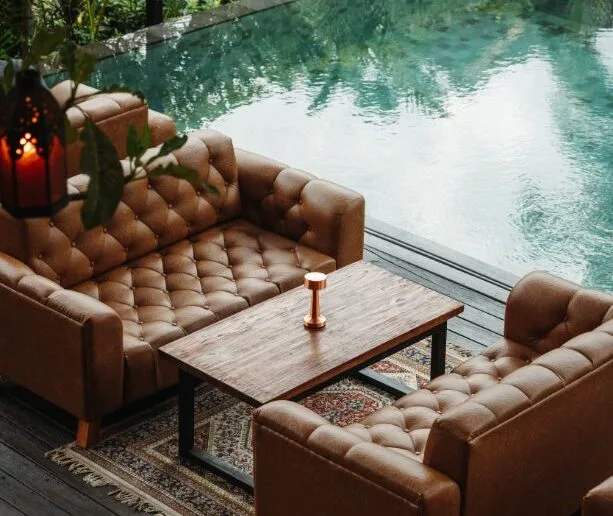 Lounge seating beside the pool at Donna in Ubud
